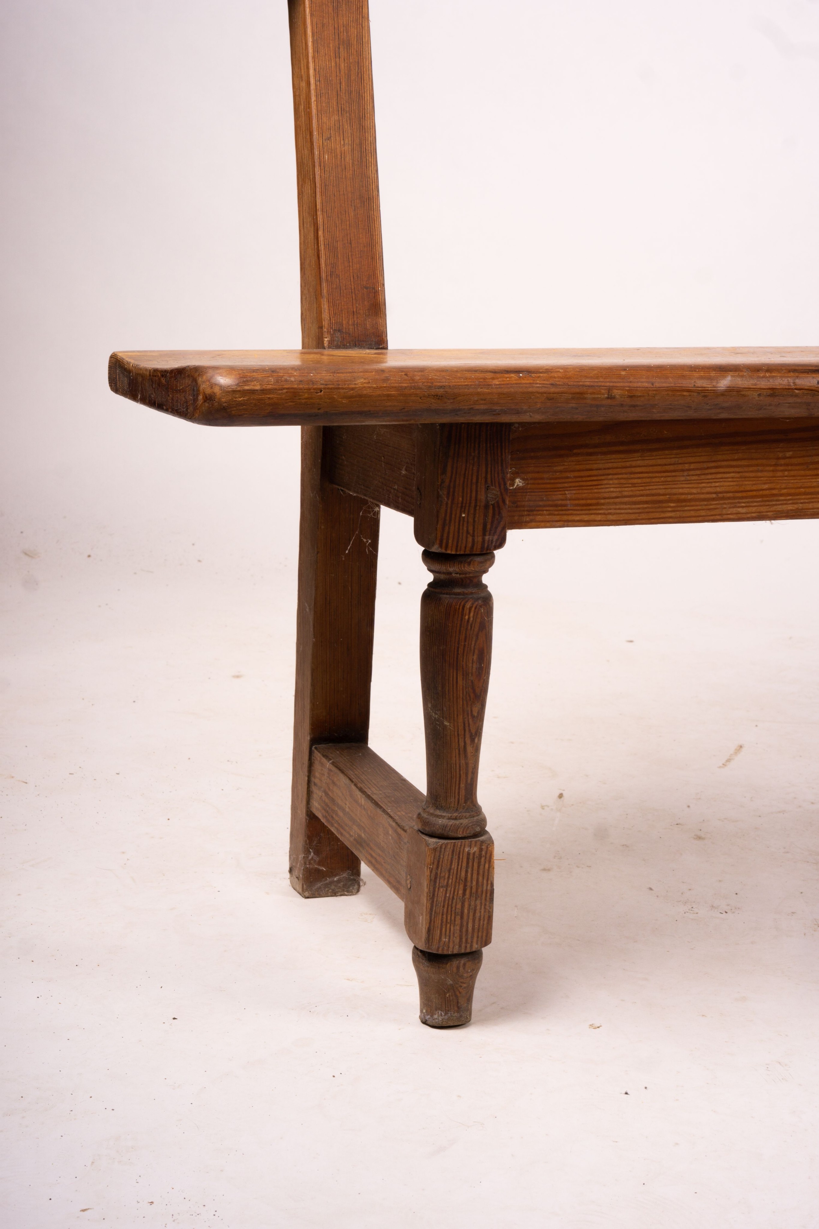 A Victorian pitch pine bench seat, W.214cm H.79cm